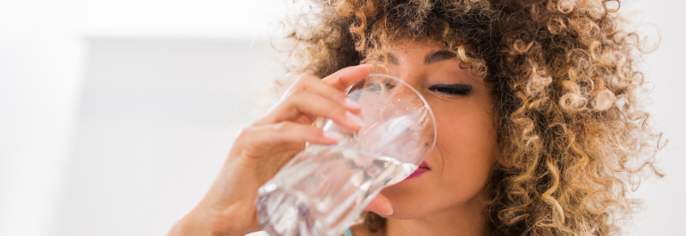 woman drinking glass of water