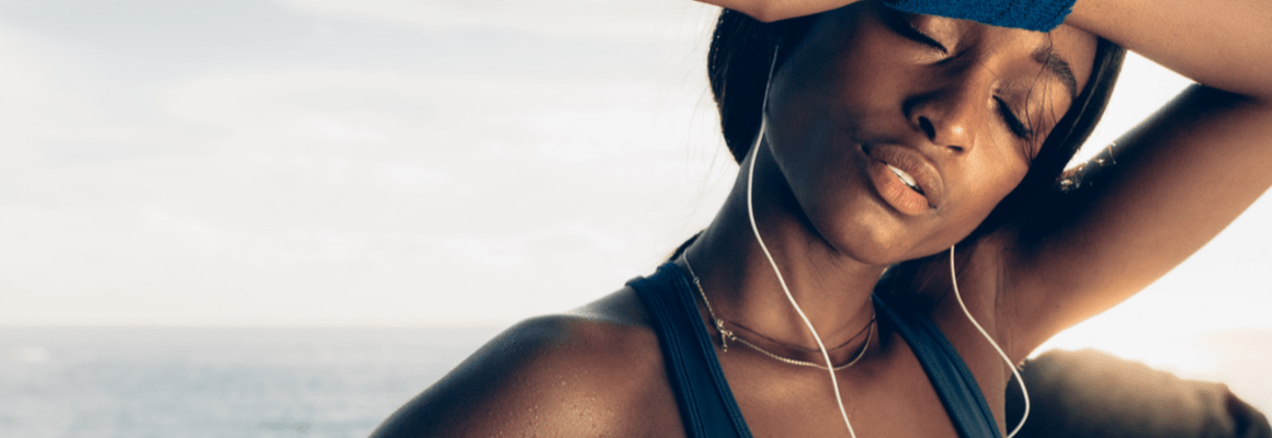 woman with earphones exercising