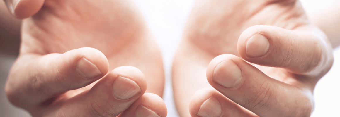 person with open hands cupped