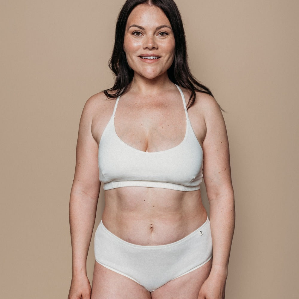 Woman wearing Q for Quinn organic cotton classic brief in natural, gentle underwear for eczema-prone skin