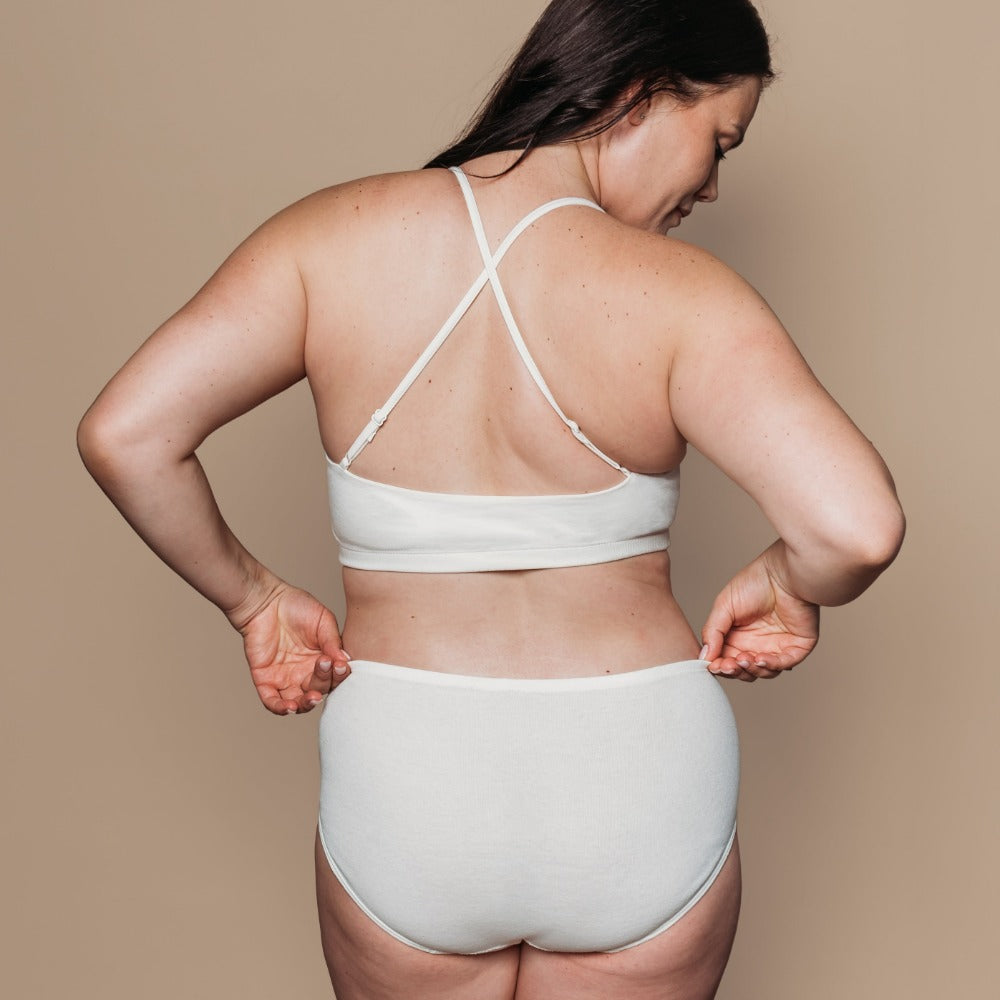 Close-up side view of a mid-rise organic cotton brief with flat seams to reduce irritation on sensitive skin