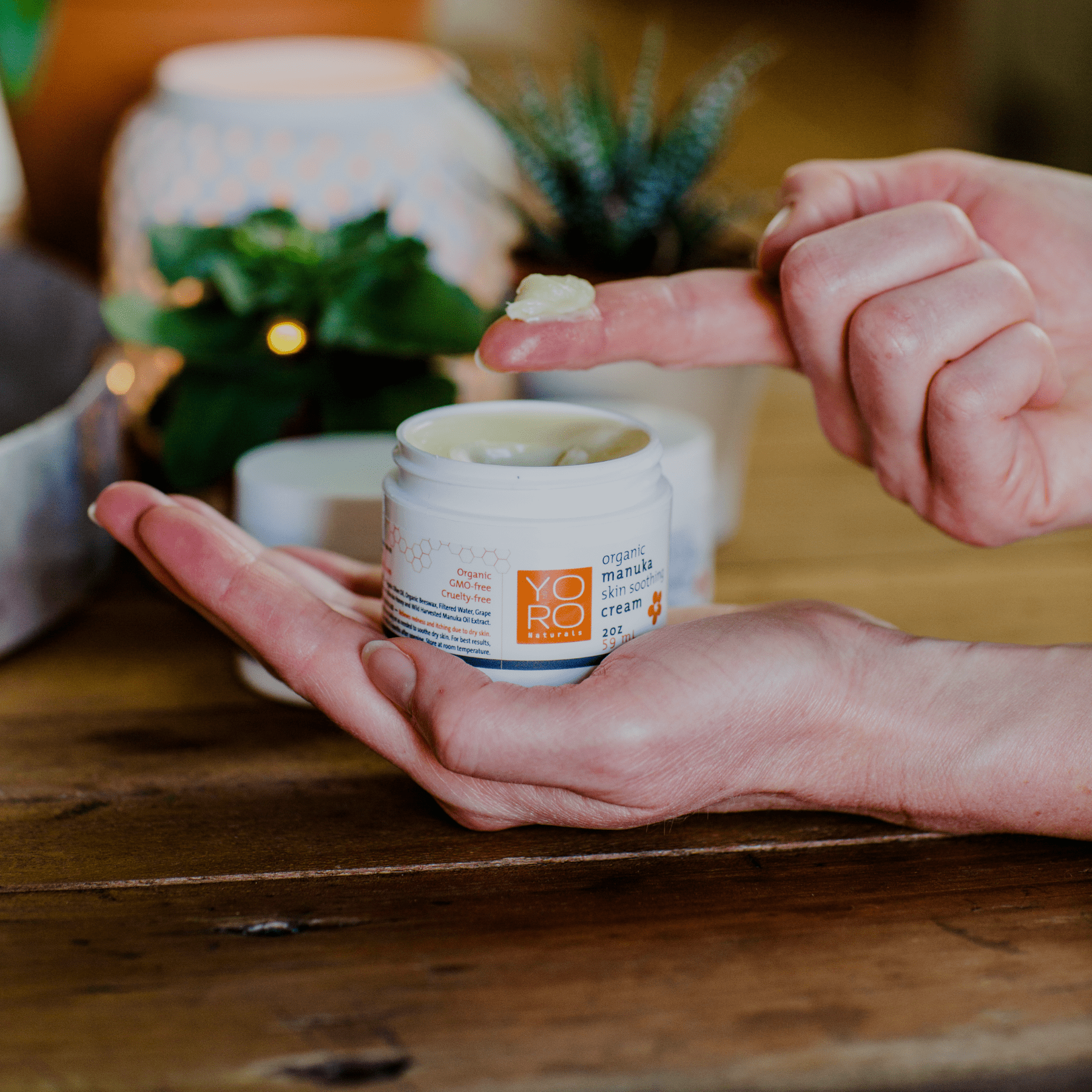 Cream, Balm, Oil with Manuka Cream and woman taking the cream out of jar