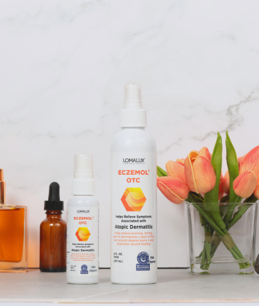 2oz and 8oz Eczemol OTC Topical Skin Spray with orange tulips and white background