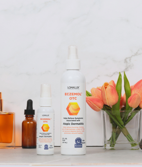 2oz  and 8oz Eczemol OTC Topical Skin Spray with orange tulips and white background