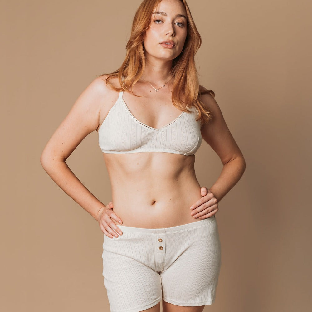 Front view of undyed natural pointelle boxers with wooden buttons, comfortable for eczema skin