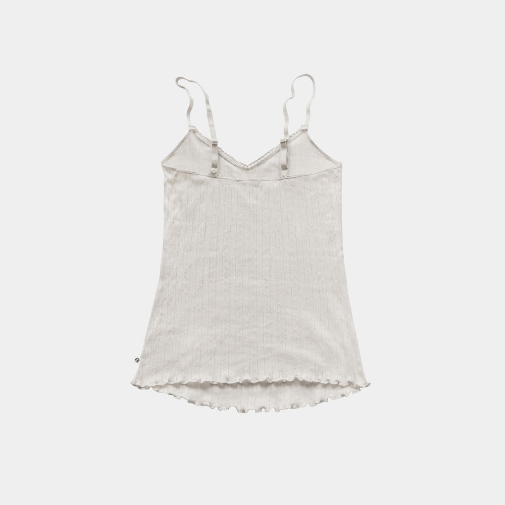 Back of the natural pointelle tank top, undyed organic cotton with adjustable straps