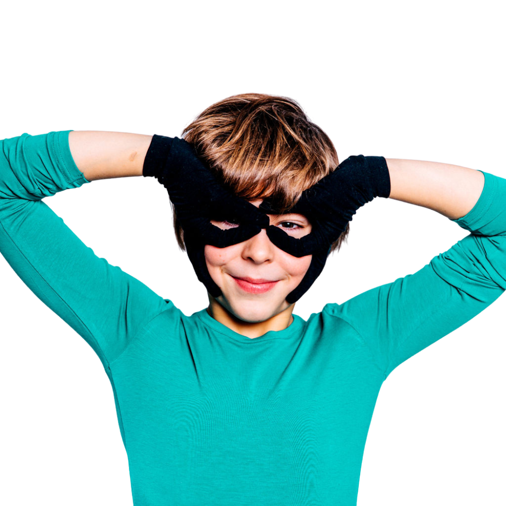 Boy making binocular eyes with his black Remedywear gloves for eczema.