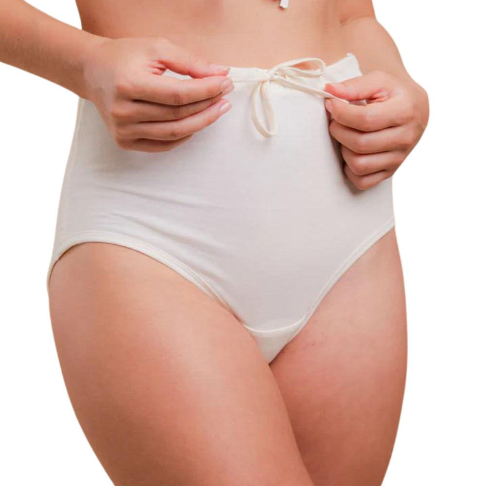 Drawstring elastic free panties in a high waisted style in white on a model.