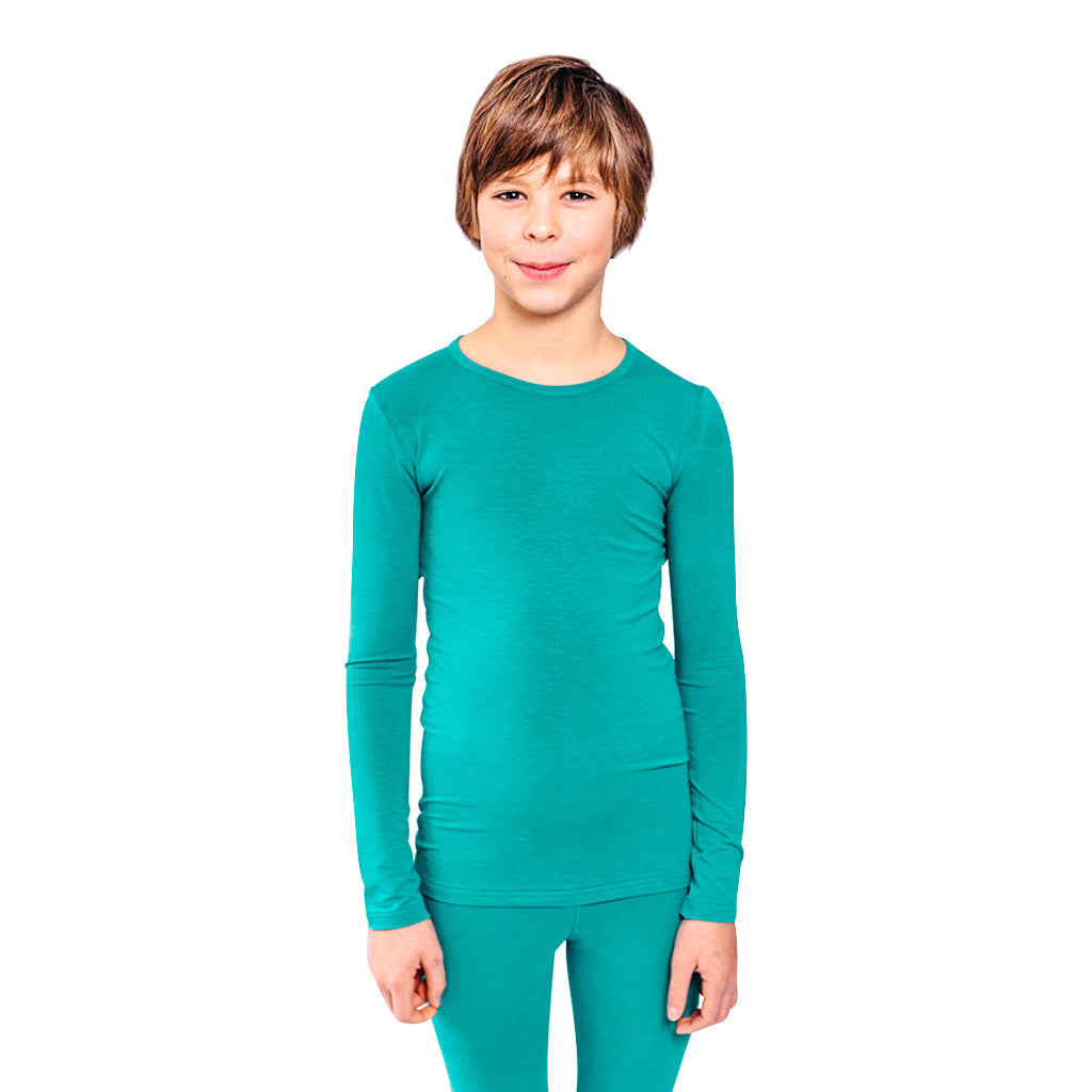 Smiling boy wearing a teal Remedywear shirt.
