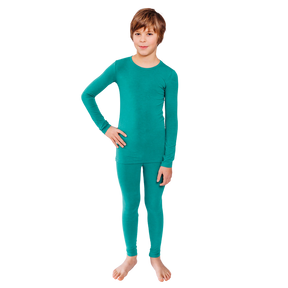 Boy with hand on hip wearing teal Remeywear long sleeve shirt and long pants.