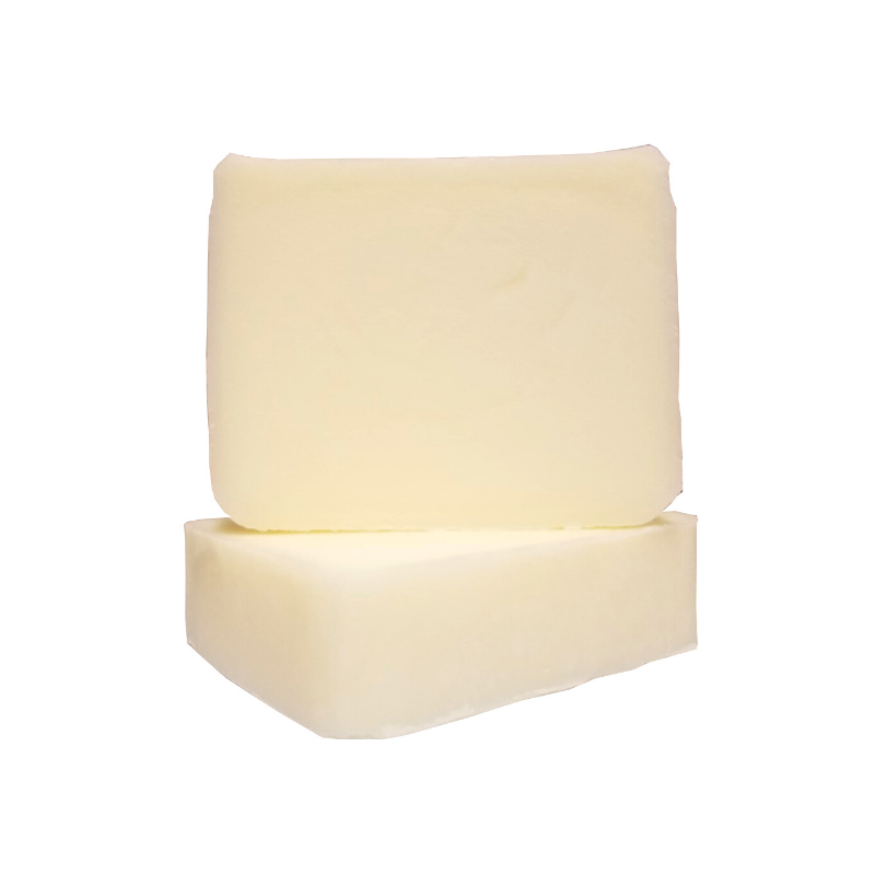 Two tallow bar soaps with zinc sitting on top of each other with a white background.