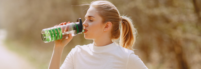 woman drinking water - eczema dehydration