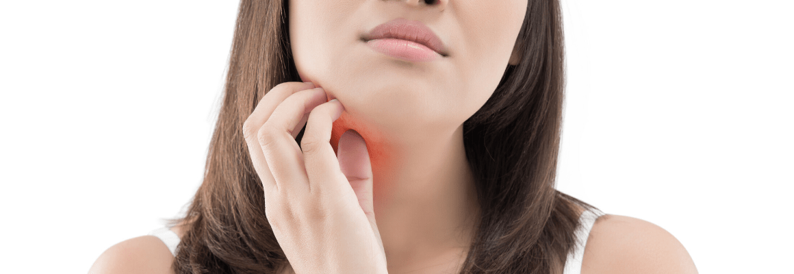 woman scratching eczema on chin