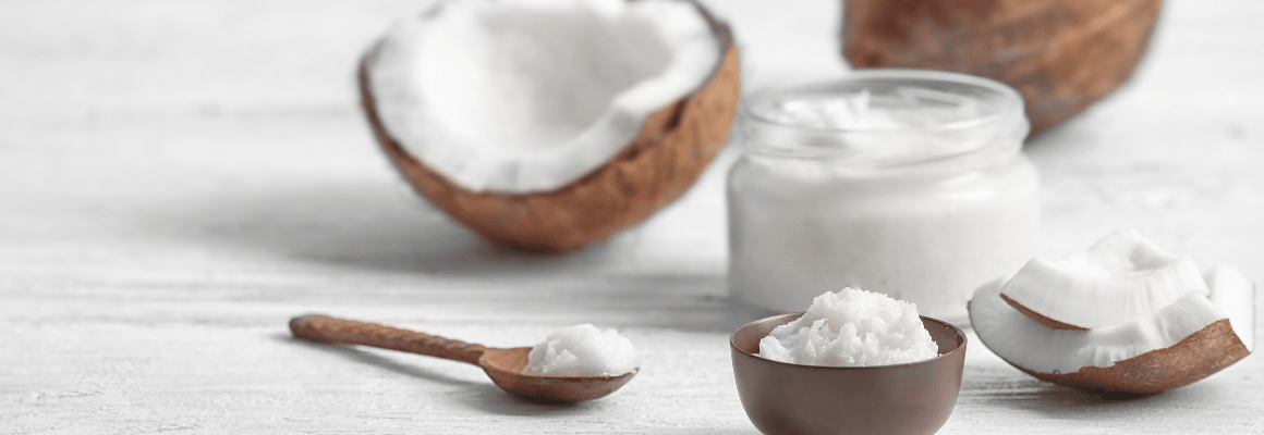coconut cut up, on spoon, and in a jar
