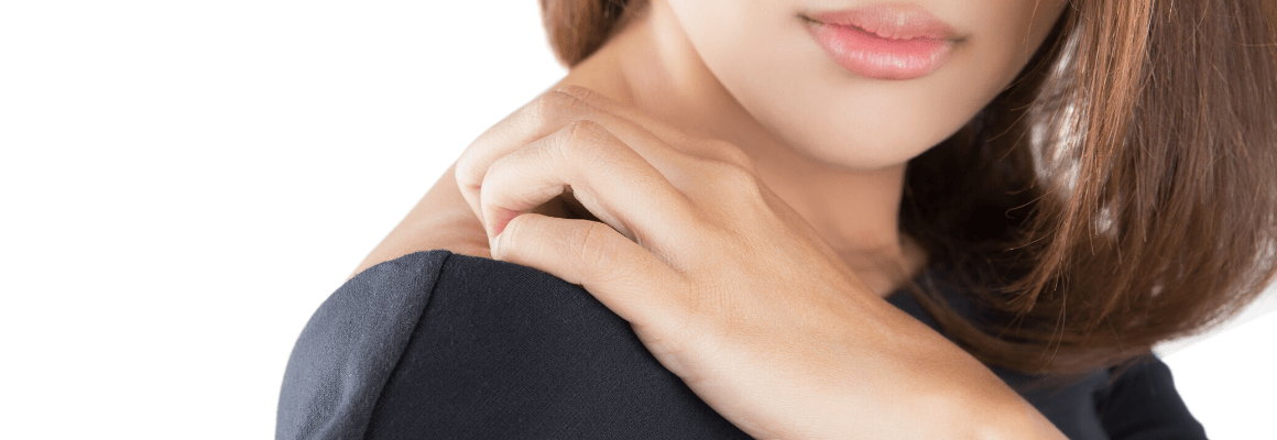 woman scratching her shoulder