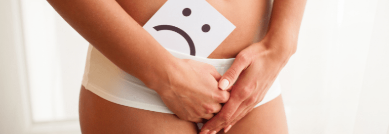 person holding a sad face over groin