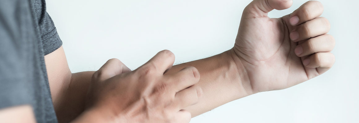 person scratching arm