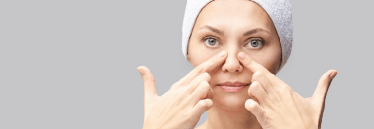woman touching her nose