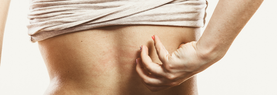 person scratching their back