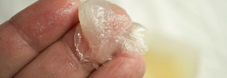 dab of petroleum jelly on fingertips