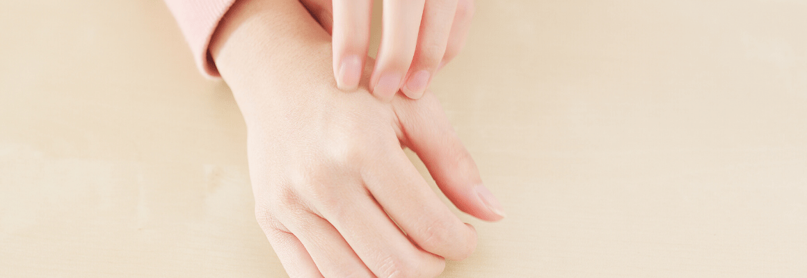 person scratching hand