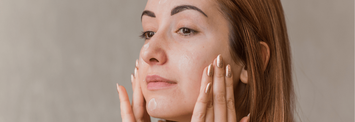 side profile of woman with hands on cheek