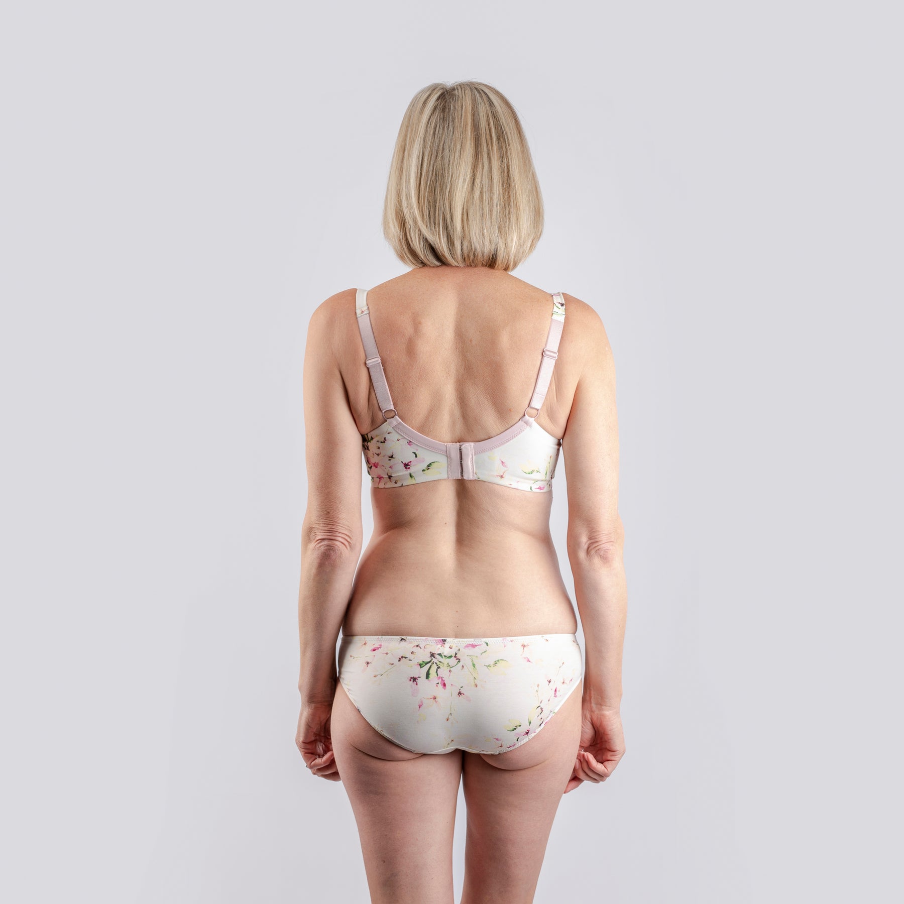 back view of woman wearing Pure Silk and Organic Cotton briefs made for people with latex sensitivity or eczema in the groin area and matching bra