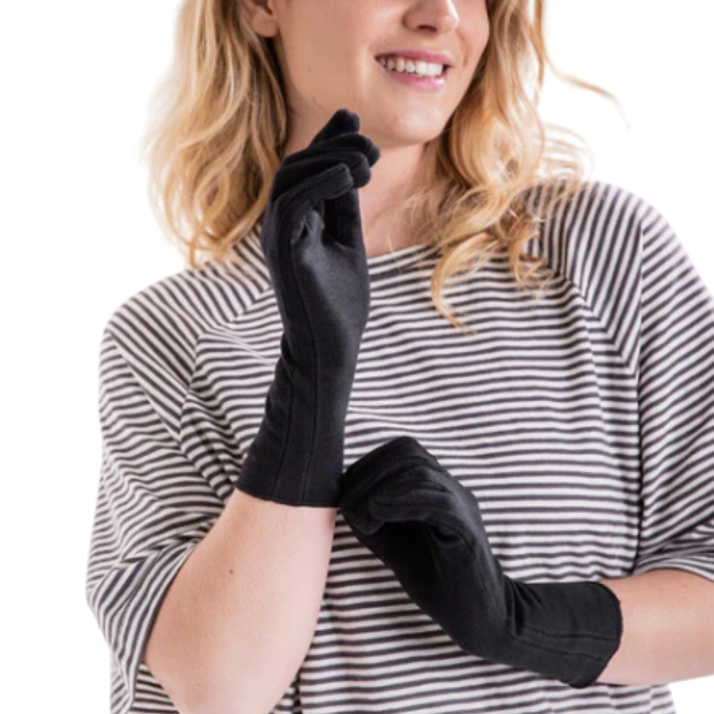woman in striped shirt wearing a pair of black organic cotton gloves for adults