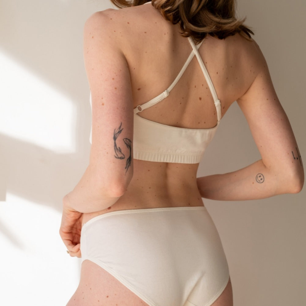 Rear view of a natural organic cotton bikini with criss-cross bralette, chemical-free underwear for eczema