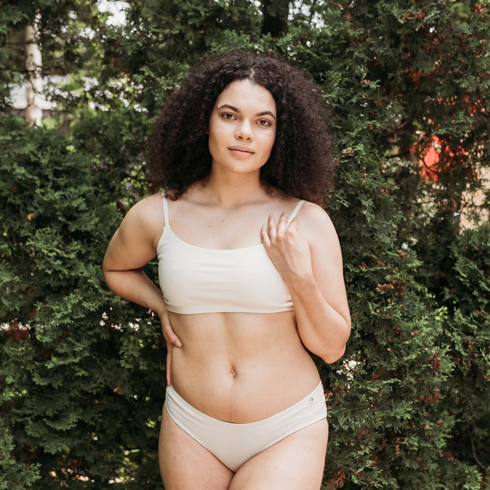 Woman outdoors in a Q for Quinn bikini made of organic cotton with biodegradable trims, eczema-friendly underwear