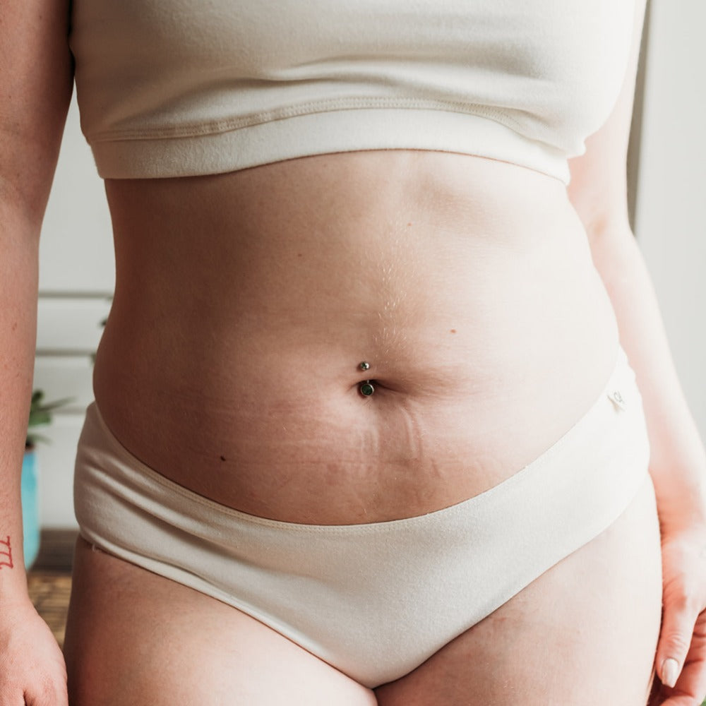Close-up of a mid-rise organic cotton bikini with flat seams to reduce itching and irritation on sensitive skin