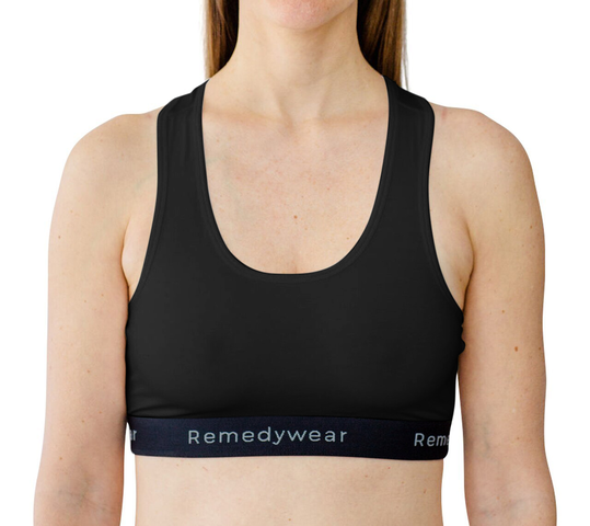 Front of a black Remedywear bra on a model.