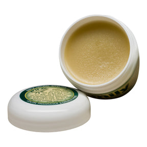 Open container of the emily skin balm showing an ointment like texture.