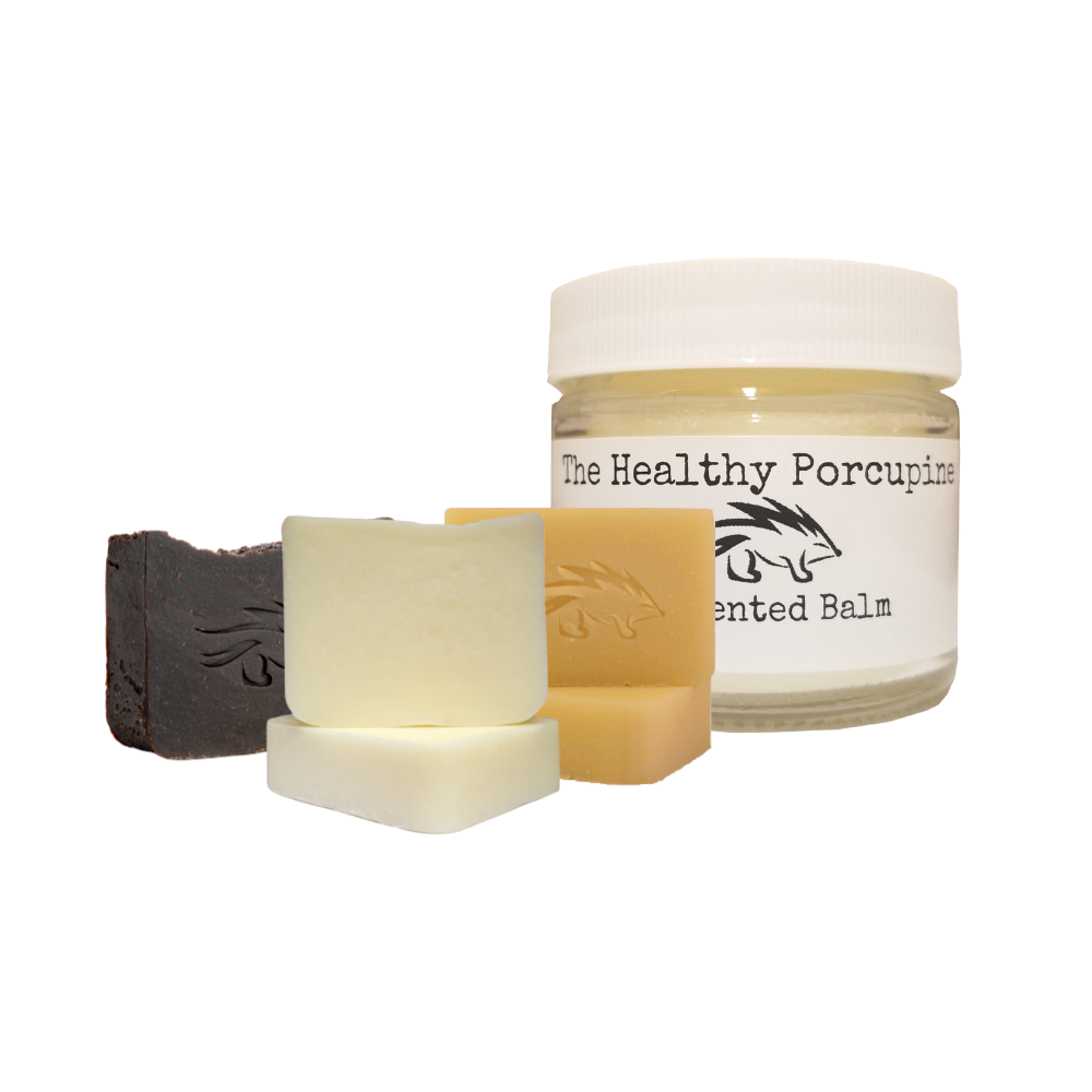 All four bundled products together with a white background. The tallow balm, and three tallow soaps.