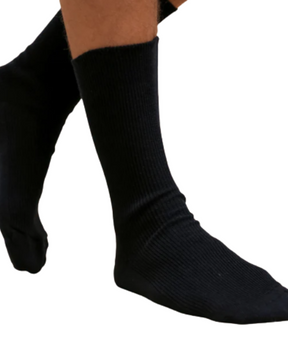 Lightweight black socks on a male model with a white background.