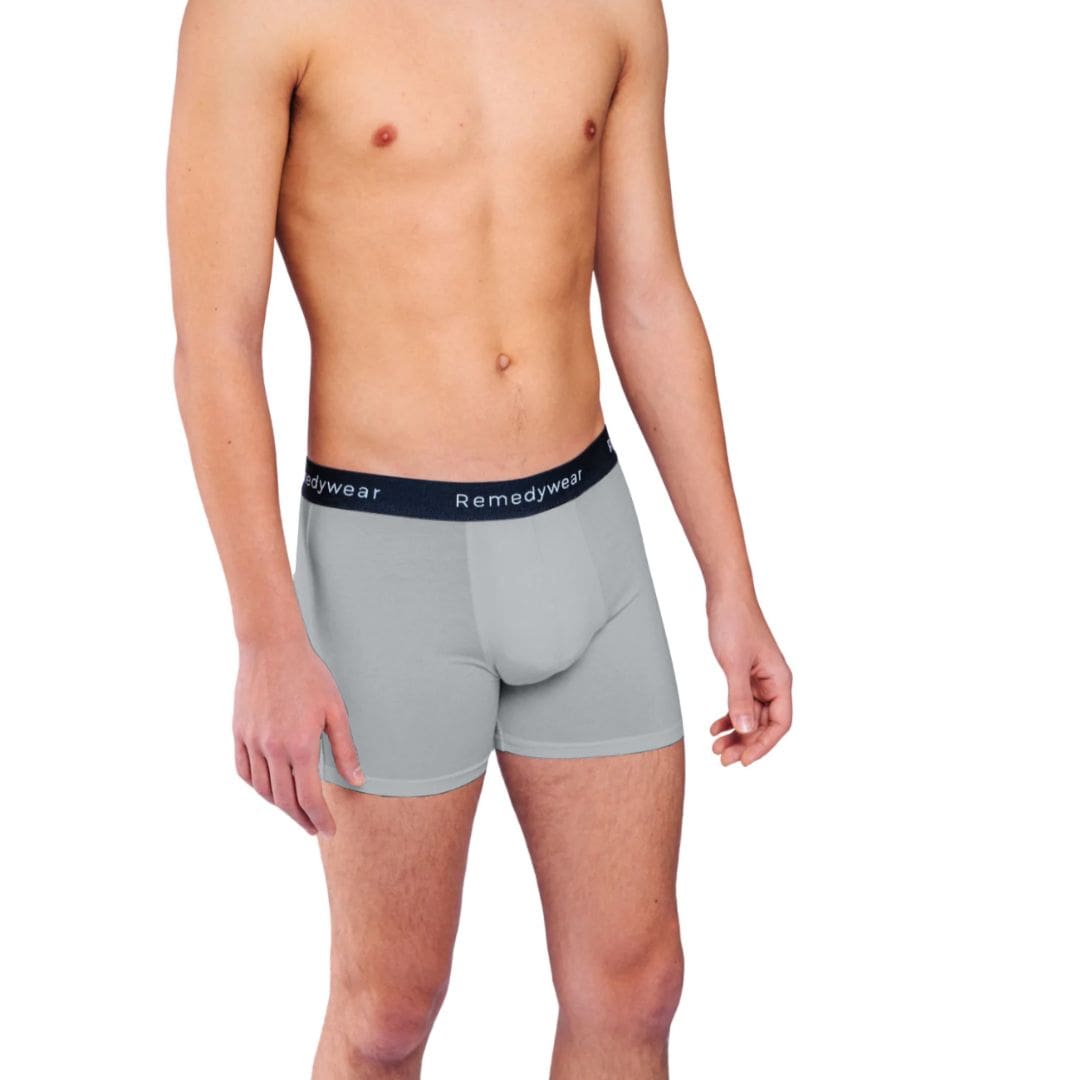 Front of model wearing grey Remedywear boxers for scrotal dermatitis treatment.