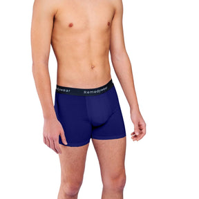 Front of model wearing navy blue Remedywear boxers for scrotal dermatitis treatment.