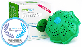 Smartklean laundry ball sitting next to it's box and with the  Parent Test Parent Approved Winner seal.