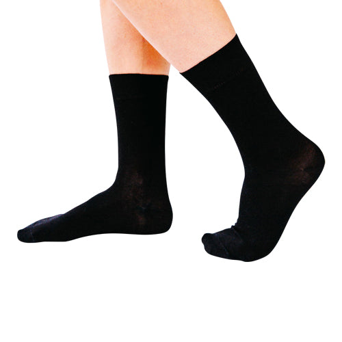 Black Remedywear socks for eczema on a a model's feet. 