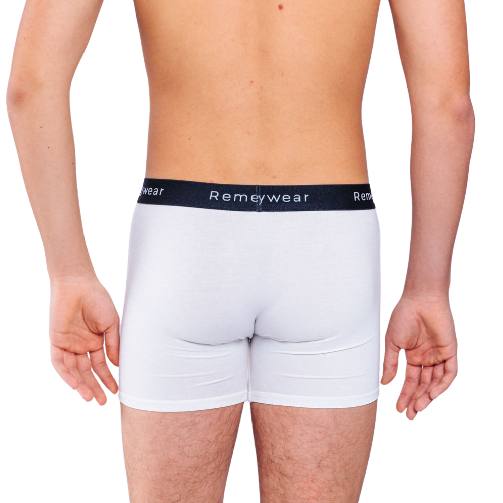 Back of white Remedywear boxers on a model.