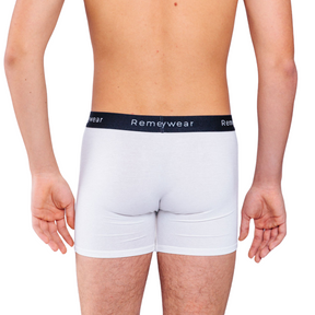 Back of white Remedywear boxers on a model.