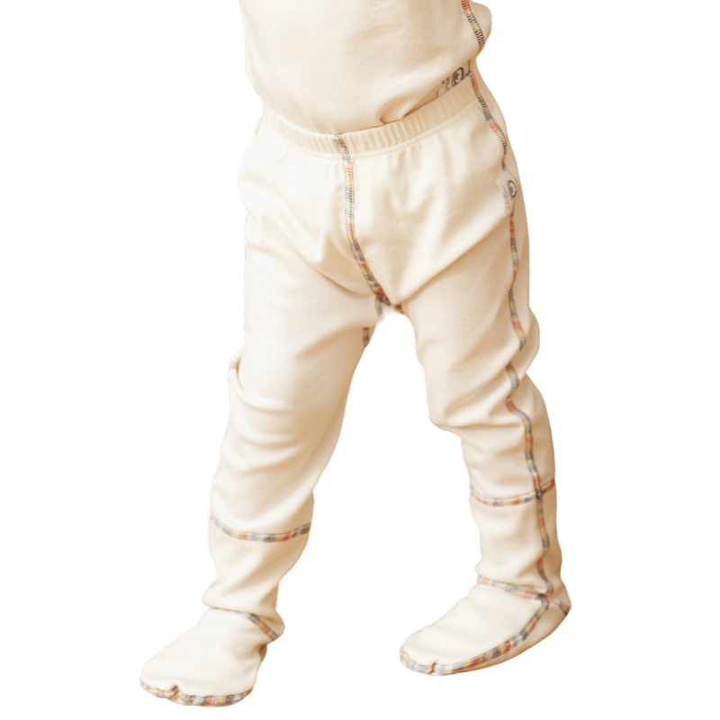 Organic cotton footed pants for kids on small child.