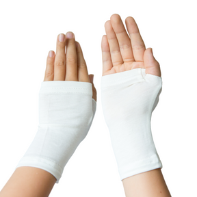 Two white Remedywear gloves on a child's hands.