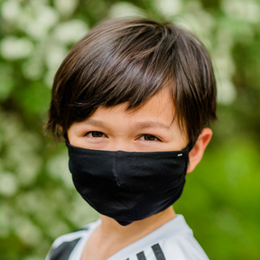 Boy wearing a black face mask.