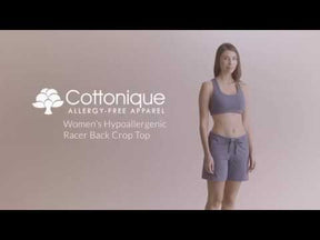 Model demonstrating the fit of the woman's cotton racerback sports bra.