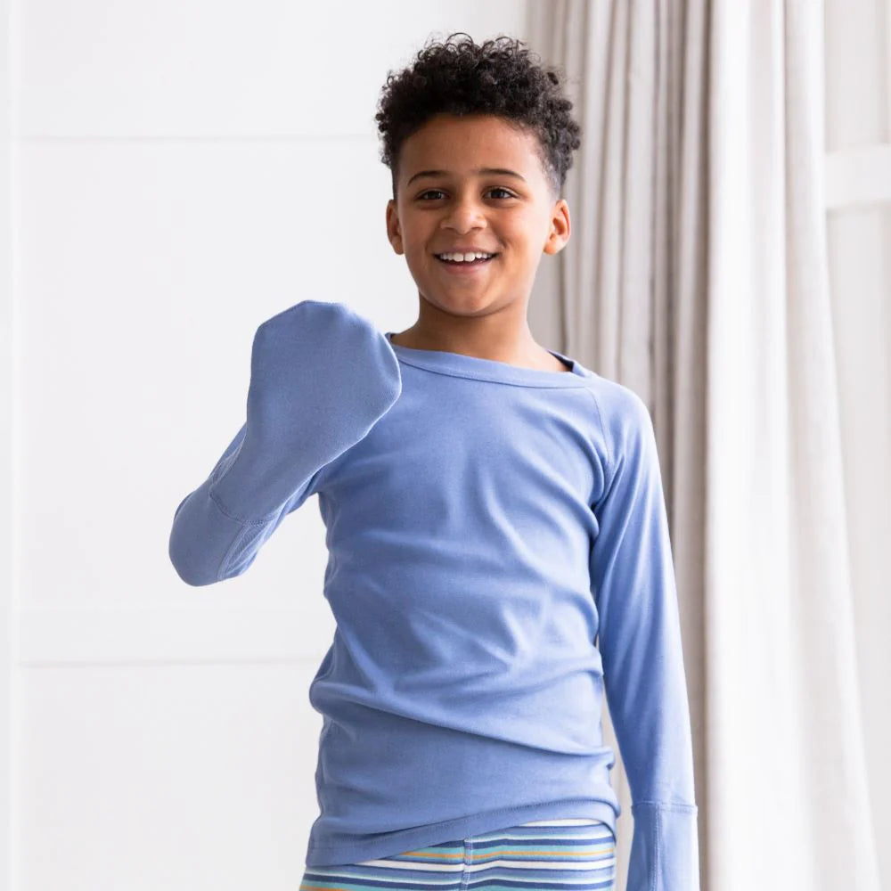 Child wearing an organic cotton scratch mitten top for eczema relief