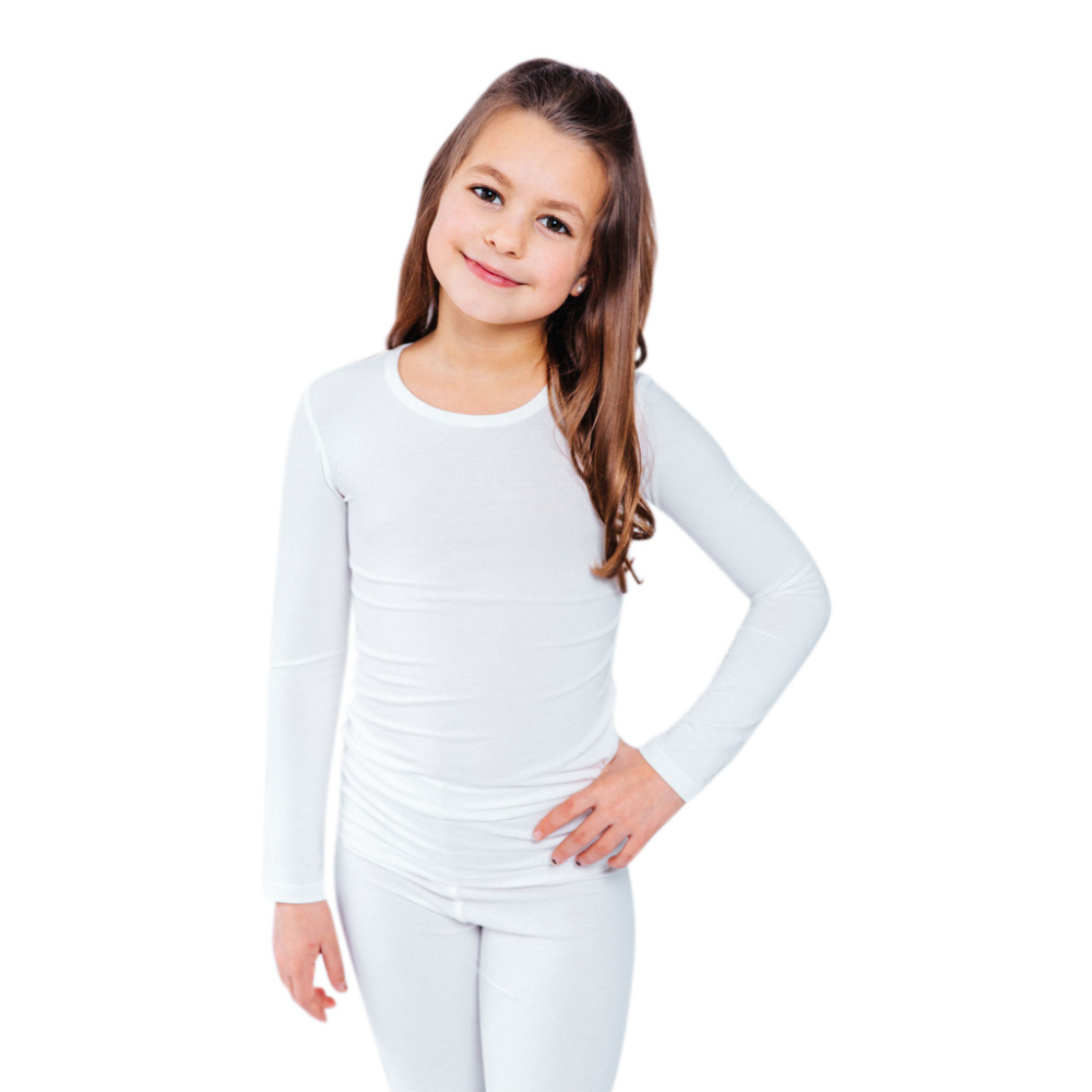 Girl with hand on hip wearing a white Remdywear long sleeve shirt for eczema.