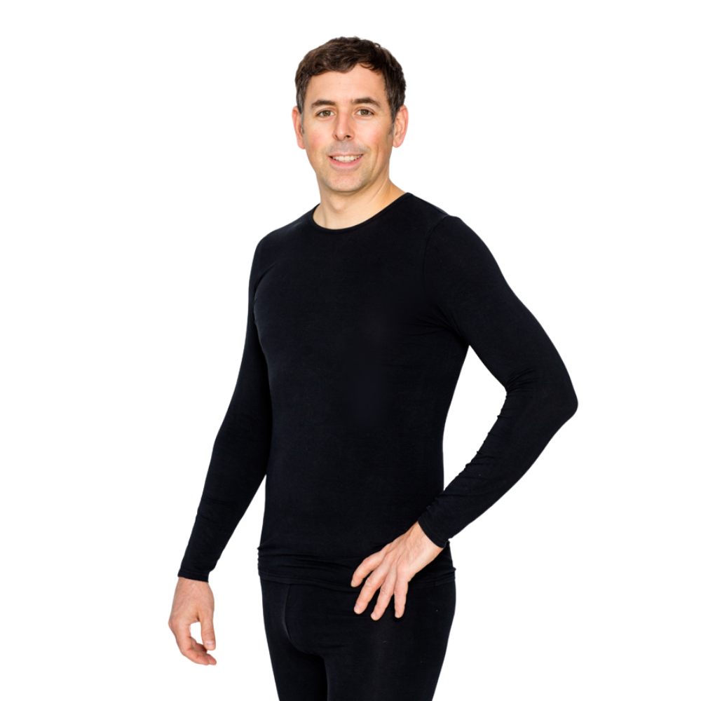 Man smiling and wearing black Remedywear shirt.