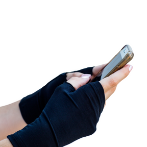 Model wearing black Remedwear gloves to treat palm eczema. 