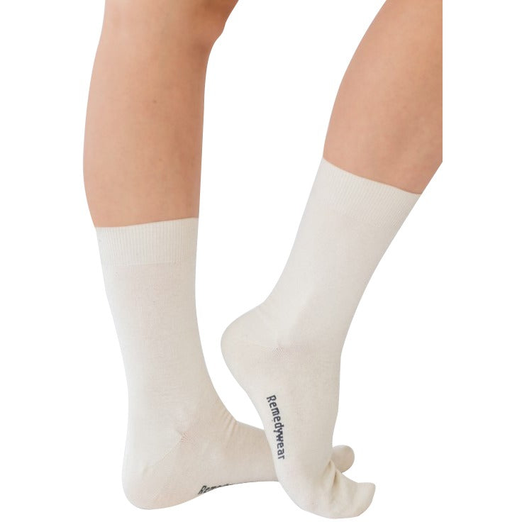 Remedywear adult socks for foot eczema blisters in the color white on a model.